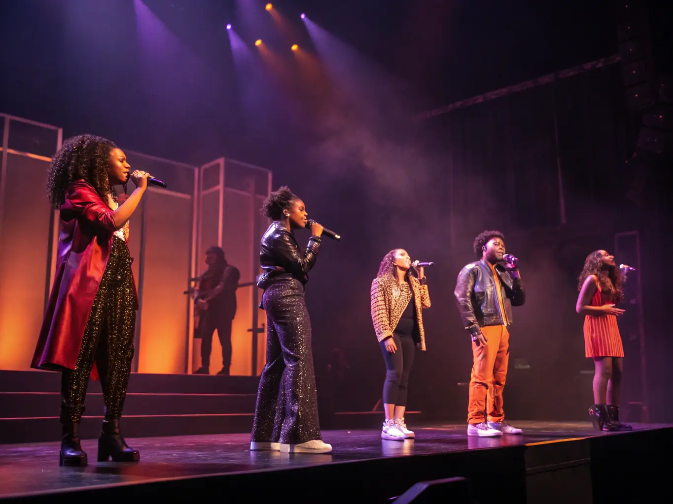 A photograph capturing a live performance supported by ASSOCIATION LE CLAVIER, featuring diverse performers and an engaged audience, highlighting the organization's role in promoting accessible and inclusive cultural experiences.